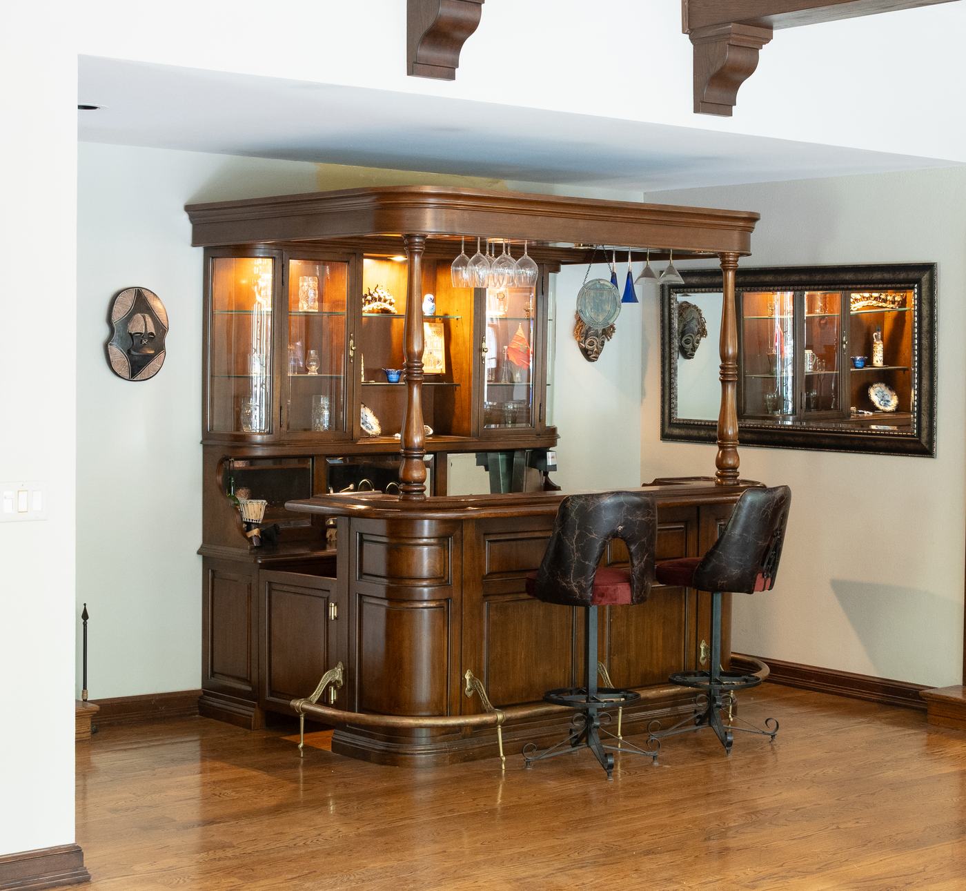 The carved wooden bar with an antique cash register