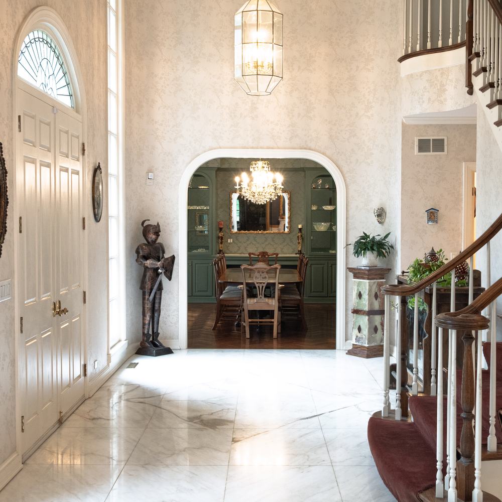 The marble entry hall looking through to the dining room