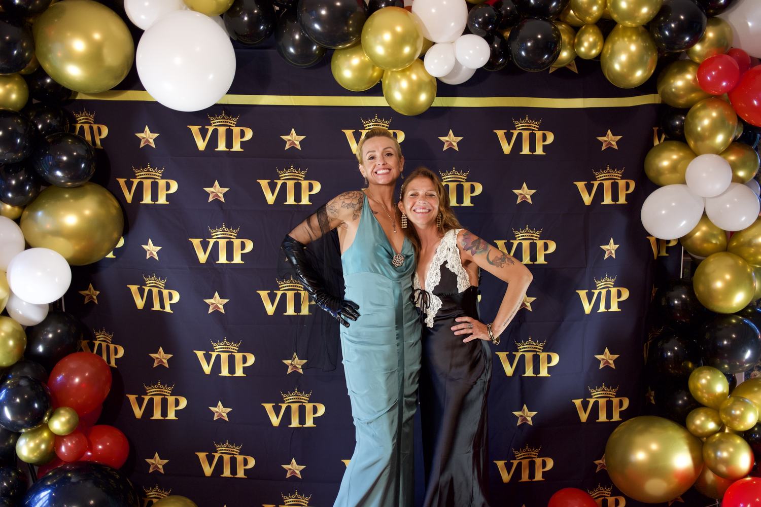 Two guests in evening gowns at an event at the estate